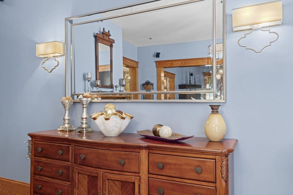 The cozy and gorgeous dining room has a fireplace and beautiful dining table