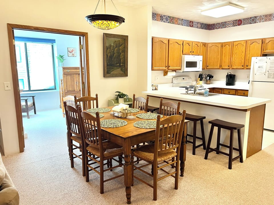 Dining area with seating for 10, plus a portable high chair
