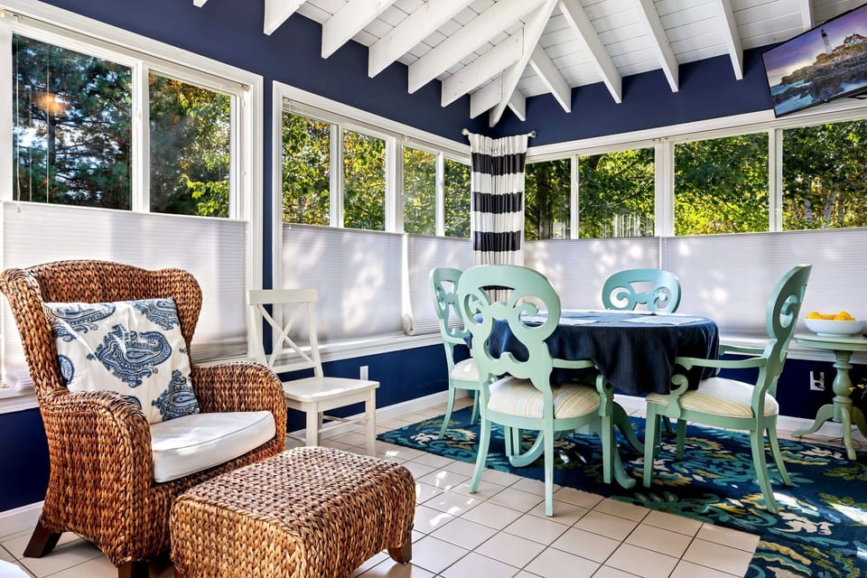 Dine alfresco or enjoy a cocktail in the charming sunroom