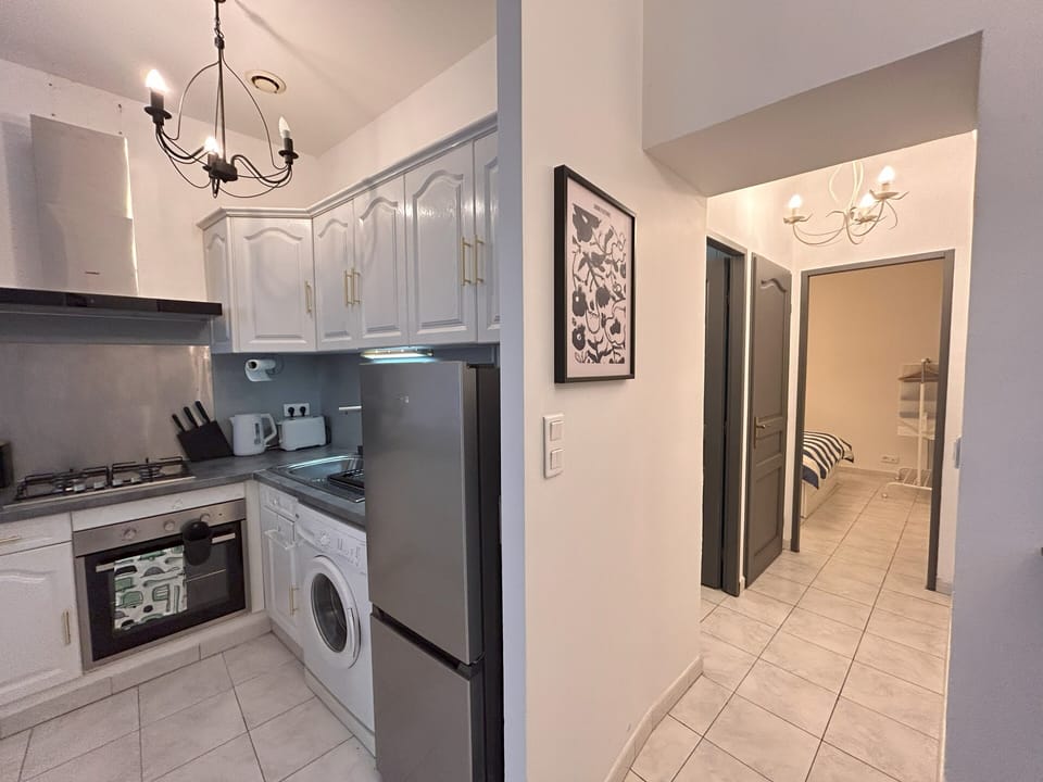 Kitchen with new oven, fridge, sink, tapware, rangehood and coffee machine