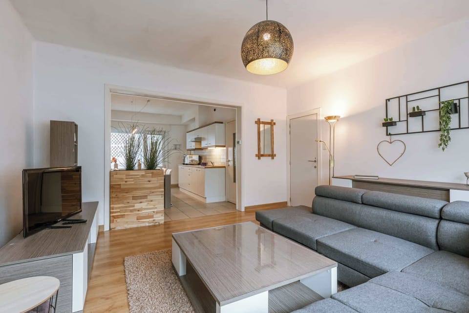 Stylish furniture, warm tones, and inviting atmosphere for relaxation.