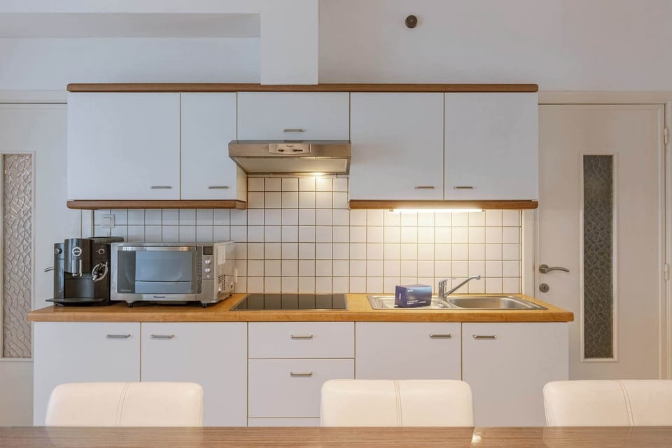 Functional kitchen with all essentials, perfect for home-cooked meals.