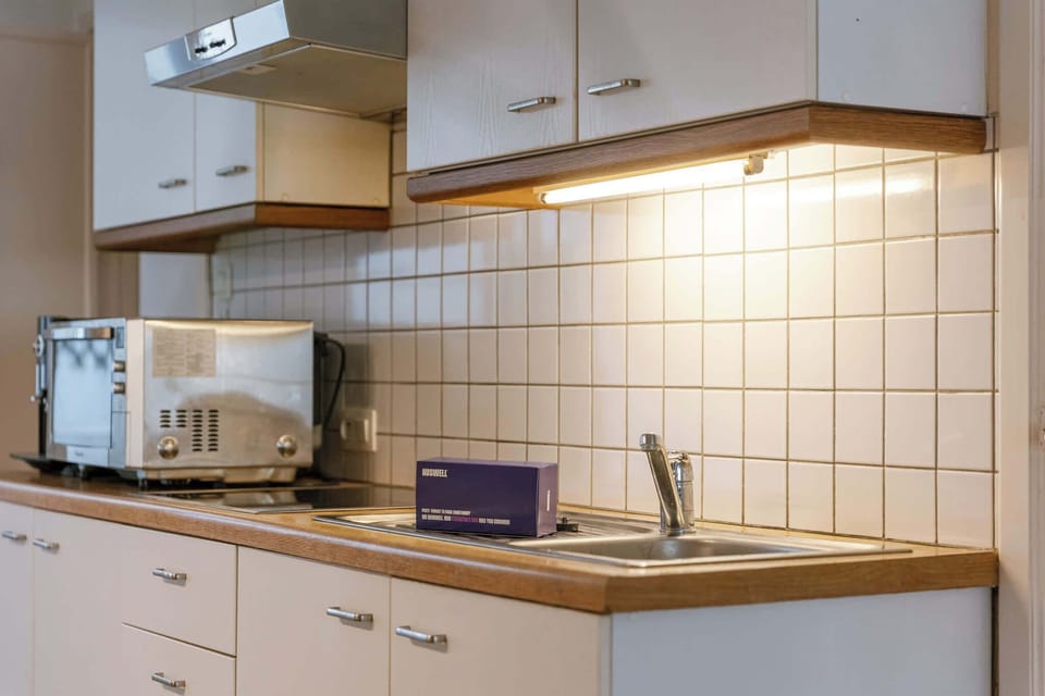 Efficient workspace with modern appliances and plenty of storage.