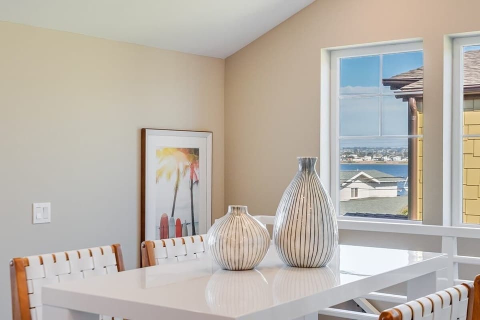 Plenty of seating! Dining table seats four and also an additional four seats at the kitchen island. Also, have a private balcony with a dining table. 