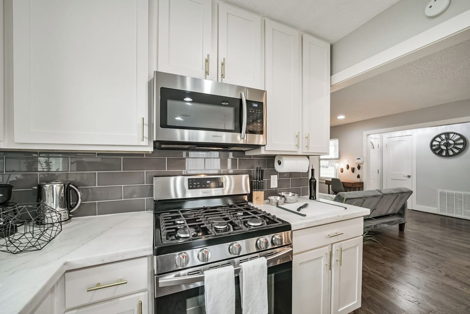 Fully equipped kitchen with modern appliances, cookware, and utensils, ready for any culinary needs.