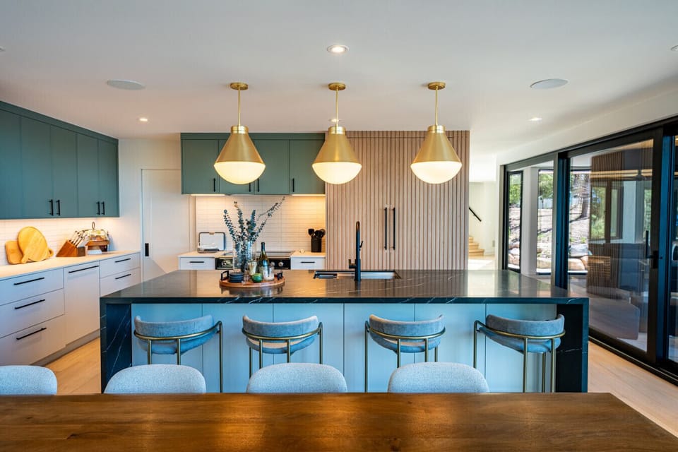 Gather around this spacious kitchen island, offering seating for four, where meals, conversation, and memories are made. With its sleek design and ample space, it's the perfect spot for everything from casual dining to lively get-togethers