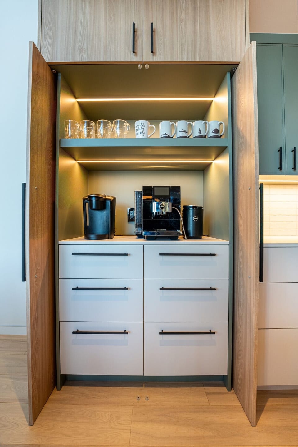 Start your day with a touch of luxury at this custom coffee station, featuring a high-end espresso machine for the perfect brew every time.