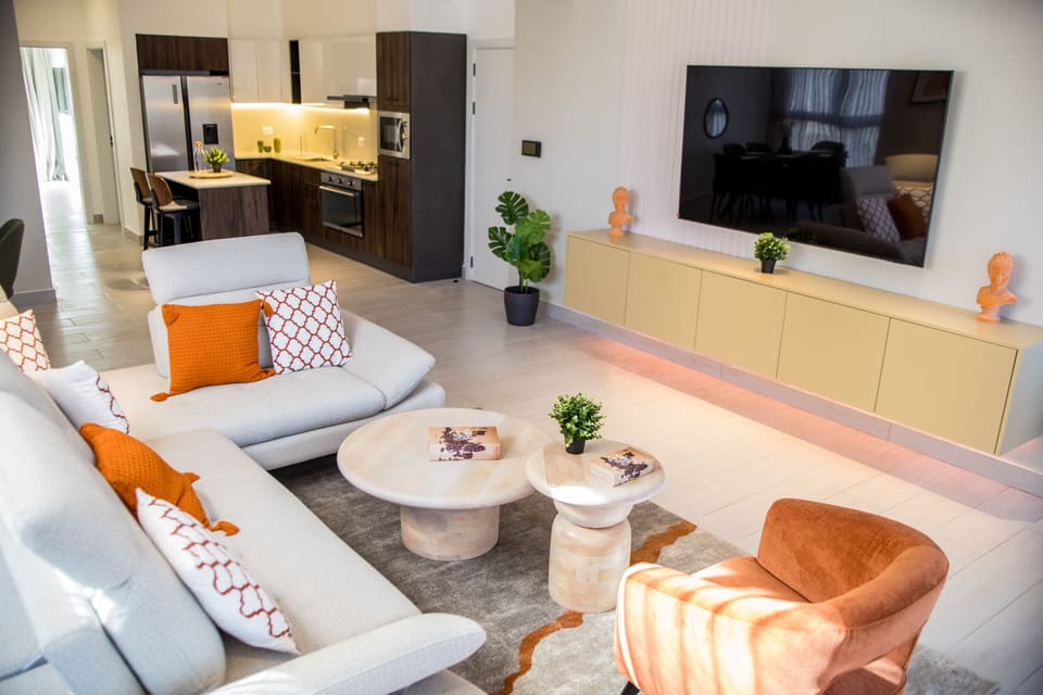 Living room with 75 inches TV.