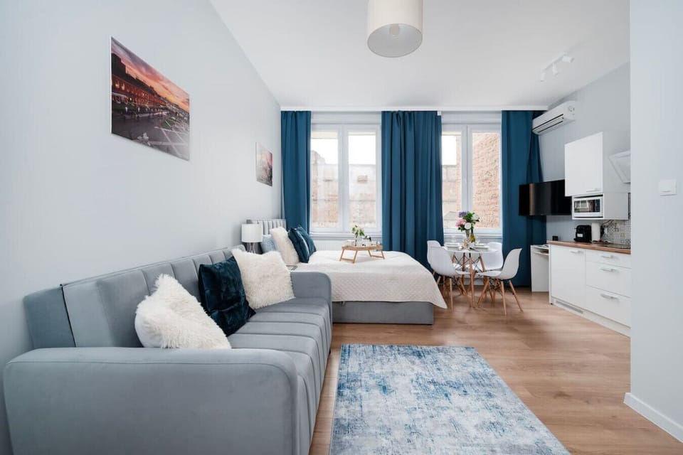 Studio - Living area with Queen Bed and Full Sofa Bed | Book Now with RENTUJEMY.COM