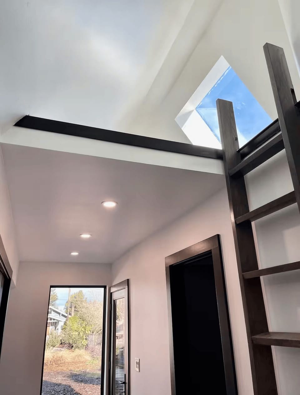 Ladder to the entertainment loft with flatscreen TV, Netflix, and bean bags.