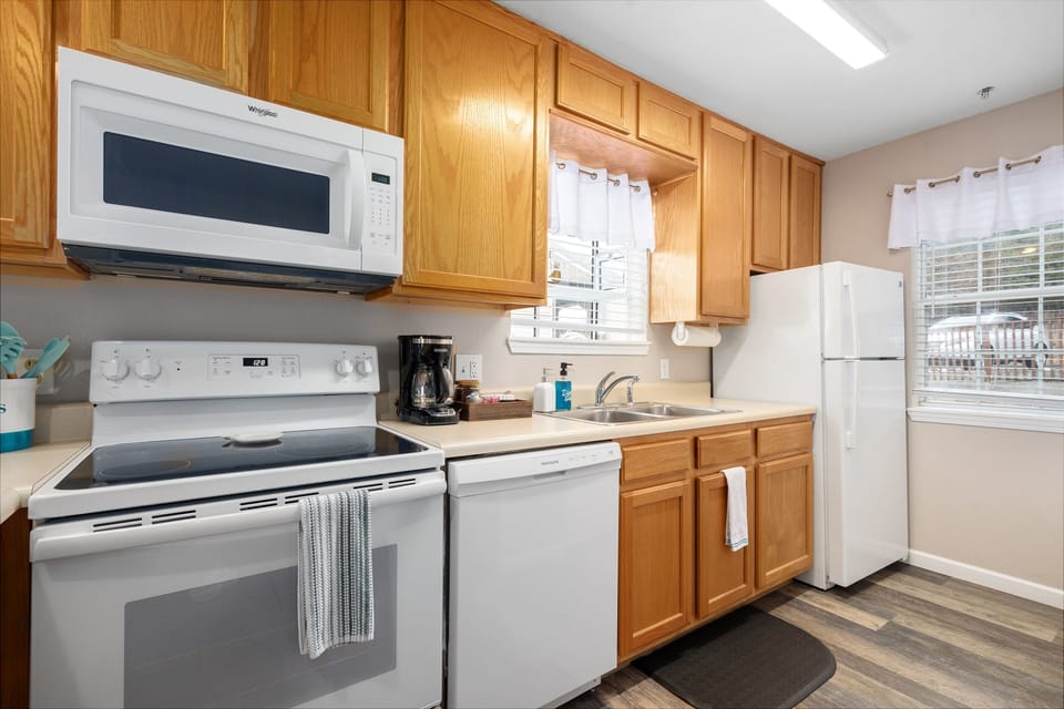 Whip up a delicious meal in the fully equipped kitchen - the heart of your cozy condo that's sure to inspire your inner chef!
