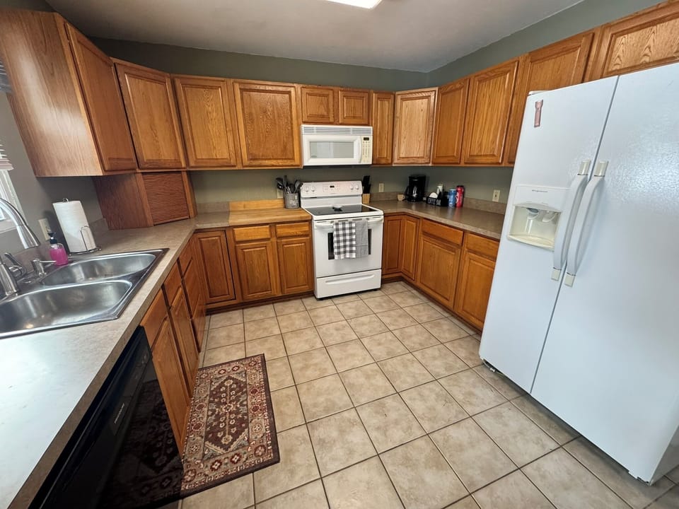 Fully stocked kitchen with everything needed to make meals during your stay. 