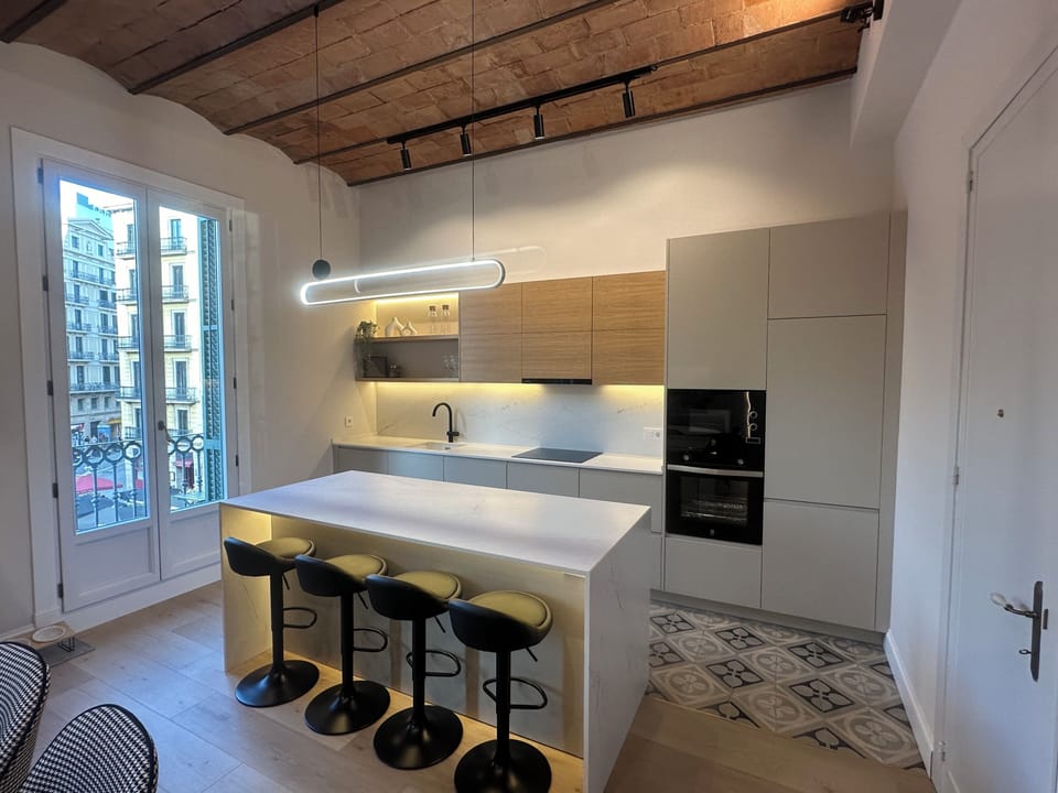 Kitchen with bar seating and walk out balcony