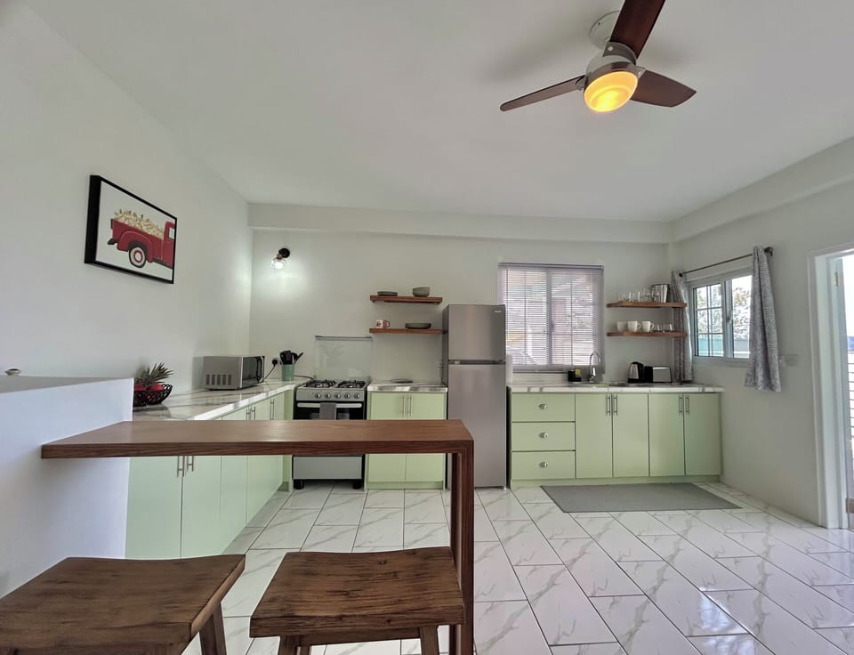 Features a microwave, kettle & toaster.