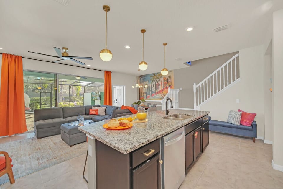 Chef’s kitchen! Fully equipped with sleek design & bar seating.