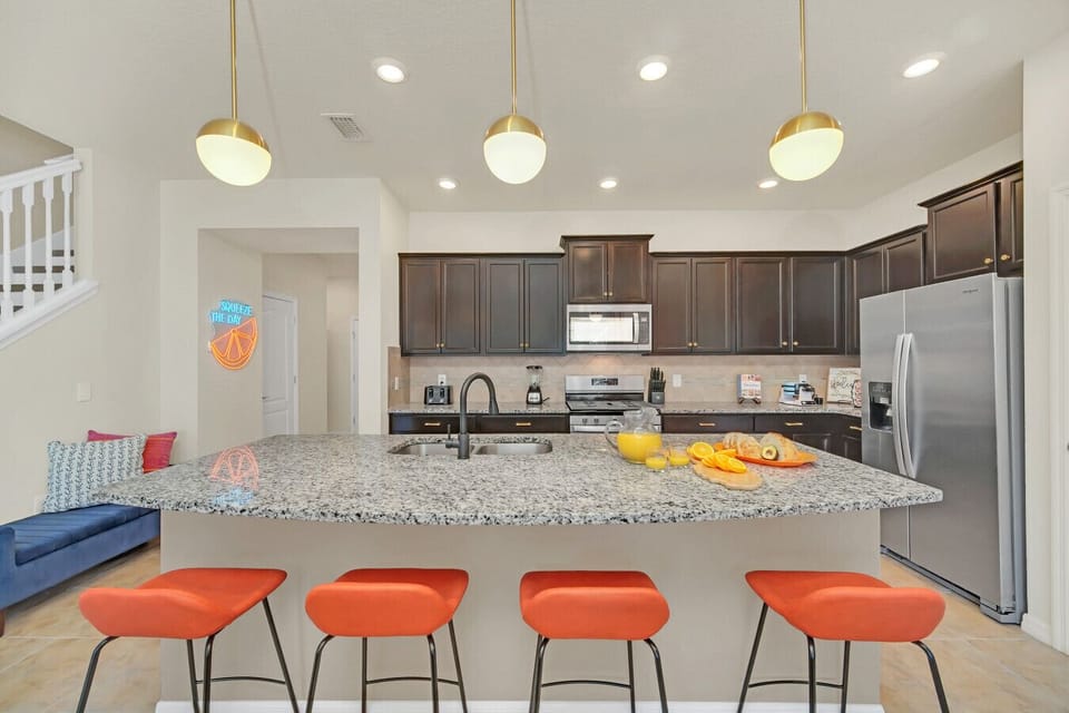 Bright & open! Modern kitchen with island & cozy living space
