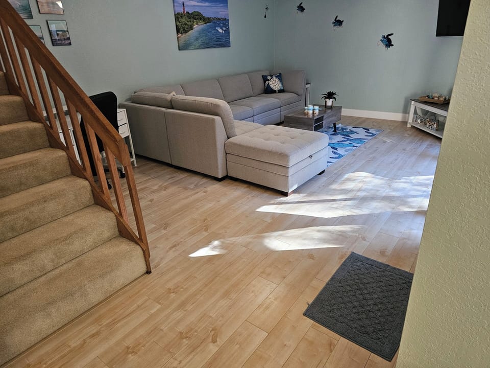 Living room, entrance and desk area.