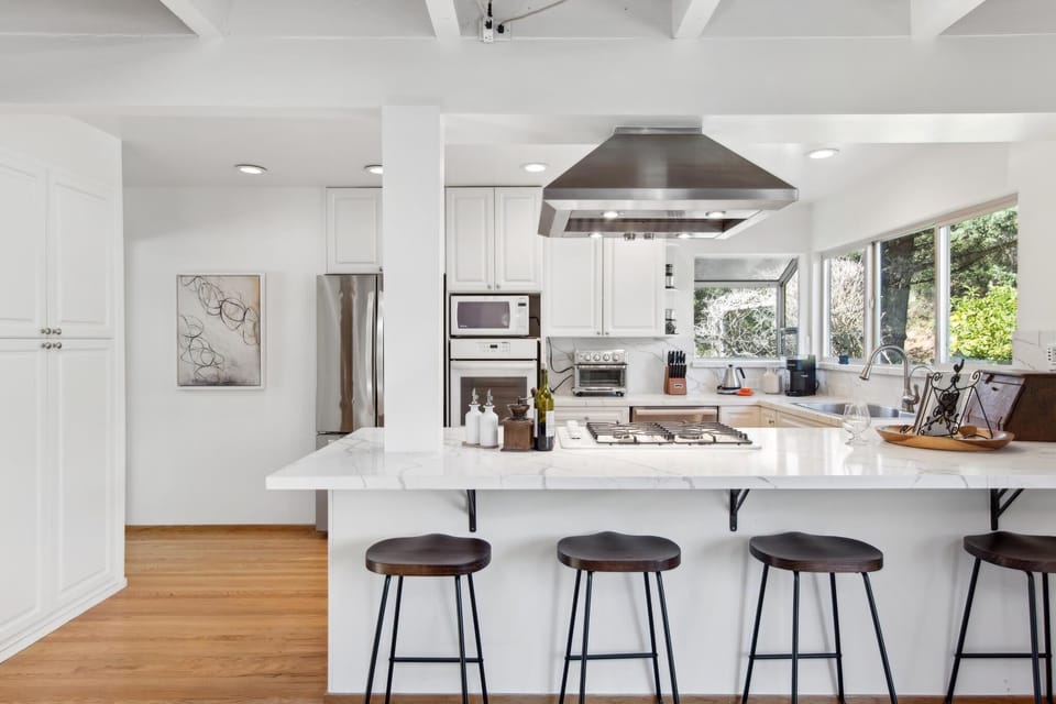 Gather around our large island with high seating—perfect for meals and memories!