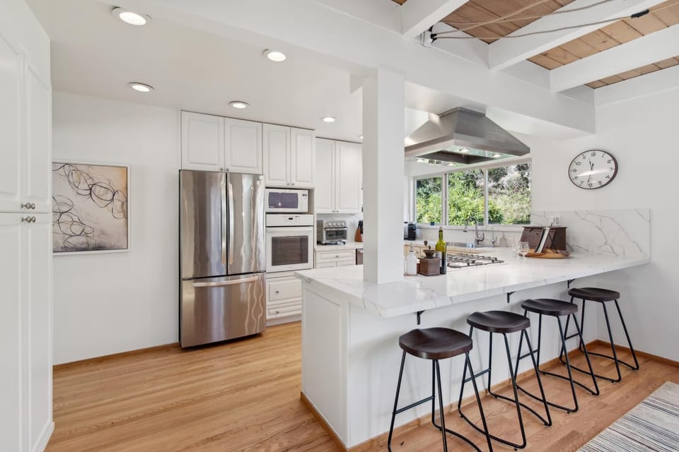 Gather around our large island with high seating—perfect for meals and memories!