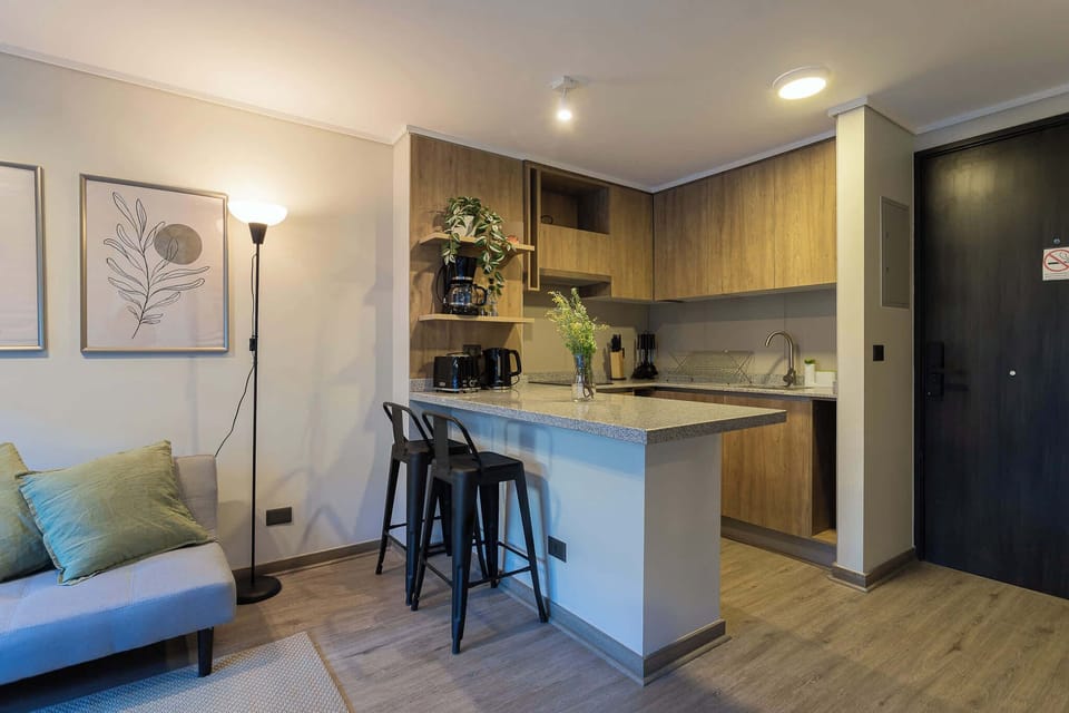 Cozy kitchen nook with modern amenities and stylish decor, perfect for a relaxing stay.