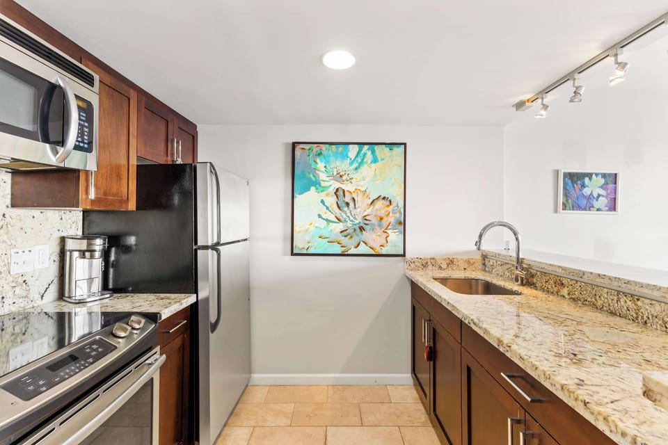 Fully equipped kitchen with granite countertops and modern appliances