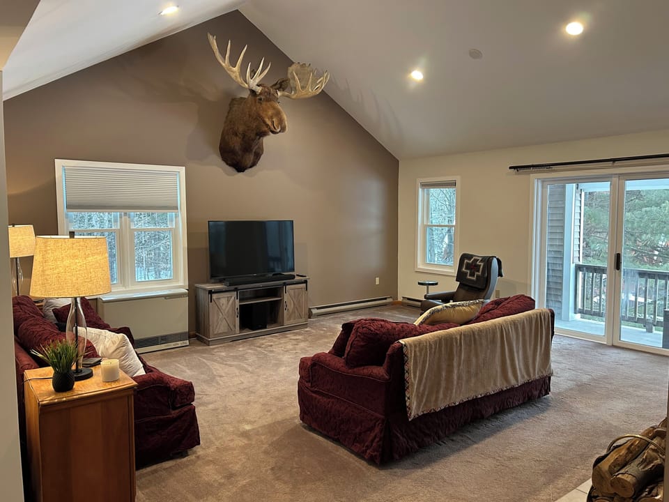 Spacious living room with majestic Bruce the Moose keeping an eye on things