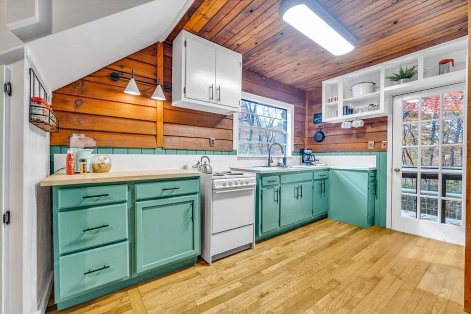 The kitchen is small but stocked with all the necessary utensils to cook a delicious cabin meal. 
