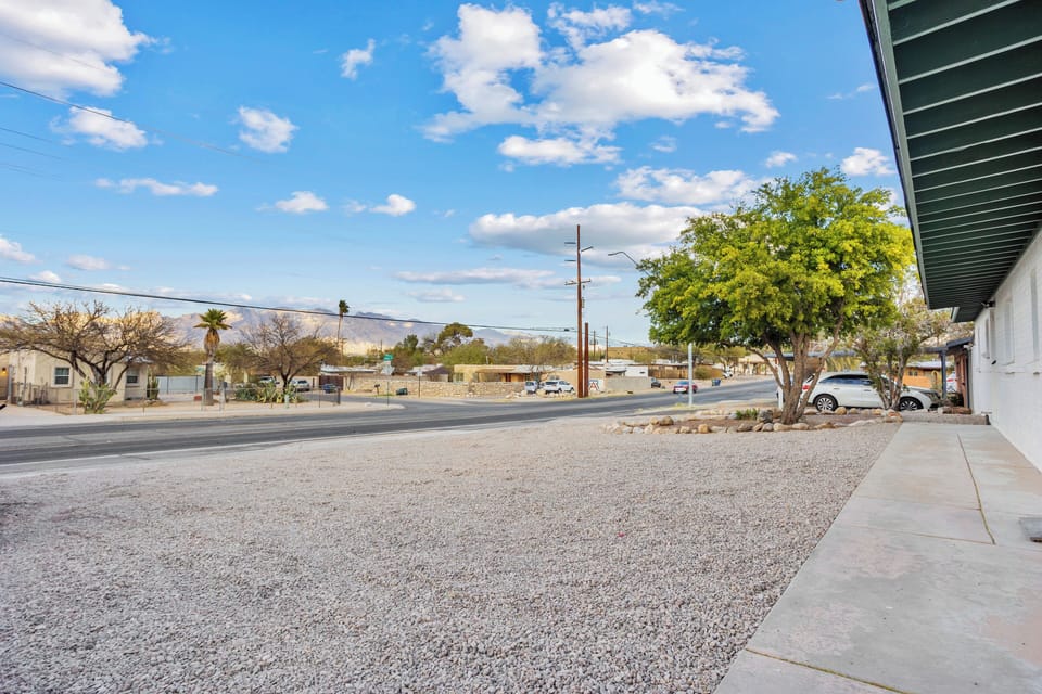 Parking lot. Please park in the space closest to the tree.