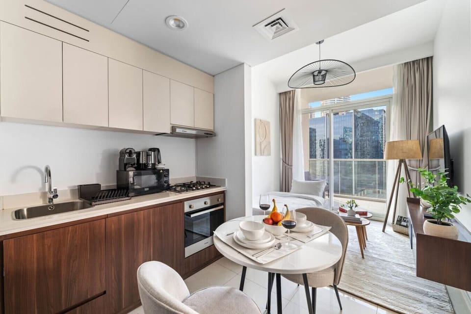 Studio Kitchen: Stylish kitchenette and dining area with skyline views, perfect for culinary adventures!