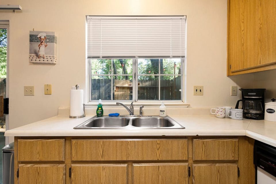 Bright kitchen with window overlooking the yard