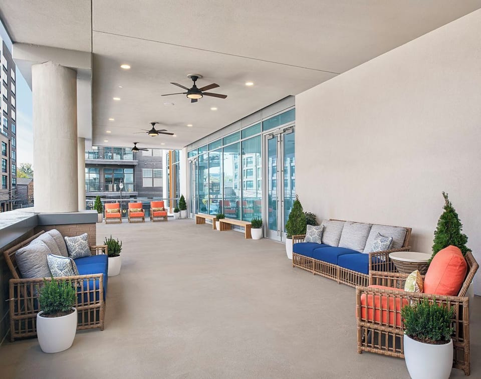 Stretch out on the covered terrace with plush outdoor sofas.