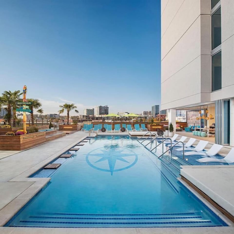 Dive into a sparkling rooftop pool with skyline views.