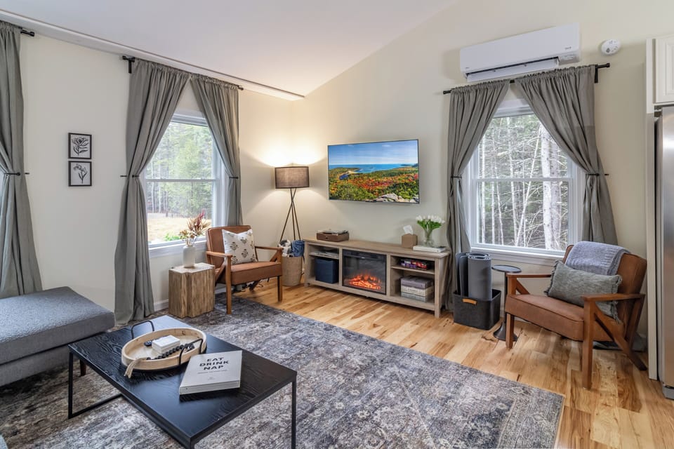 The living room is comfortable w/ an electric fireplace & record player