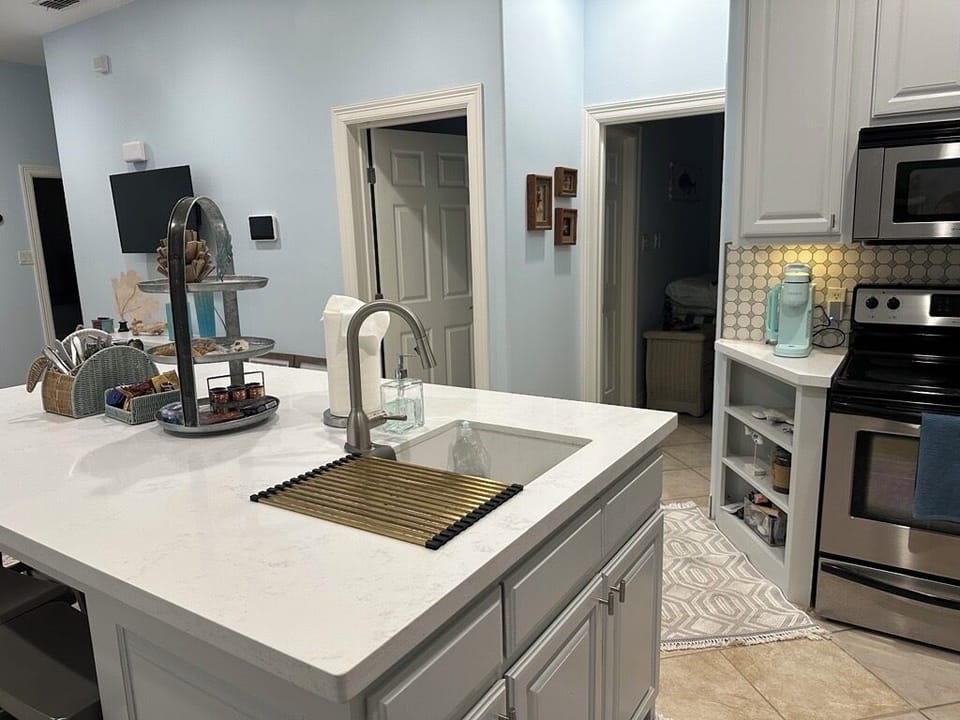 Kitchen view, bedroom and restroom access