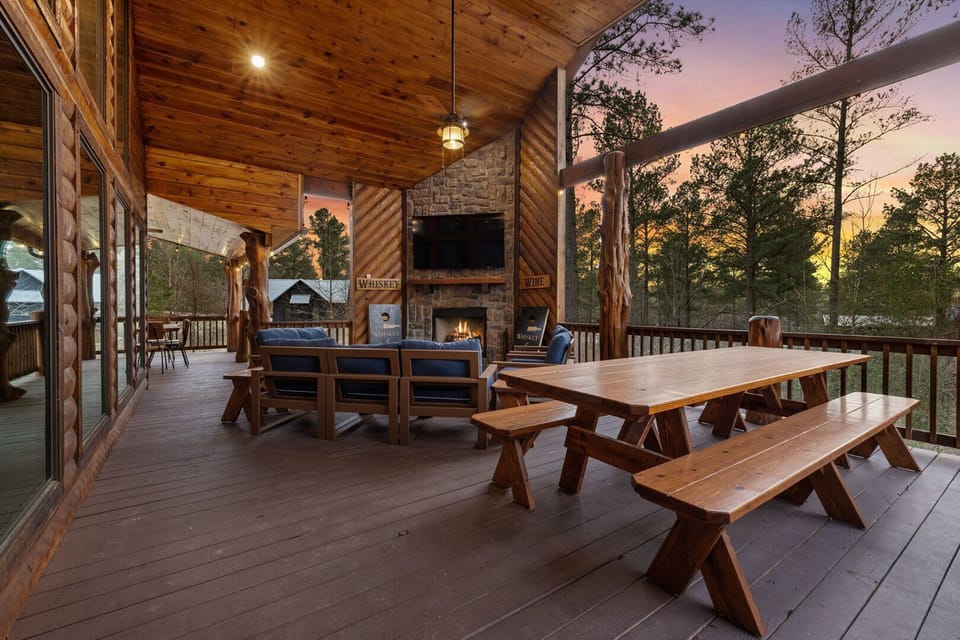 Peaceful deck views with outdoor TV, plenty of seating, and hot tub.