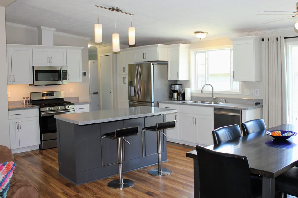 Easily prepare meals or prep for an outing in the open floor plan. 