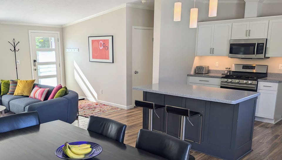 Kitchen island for a quick breakfast or cocktail hour.  Undercounter power-strip