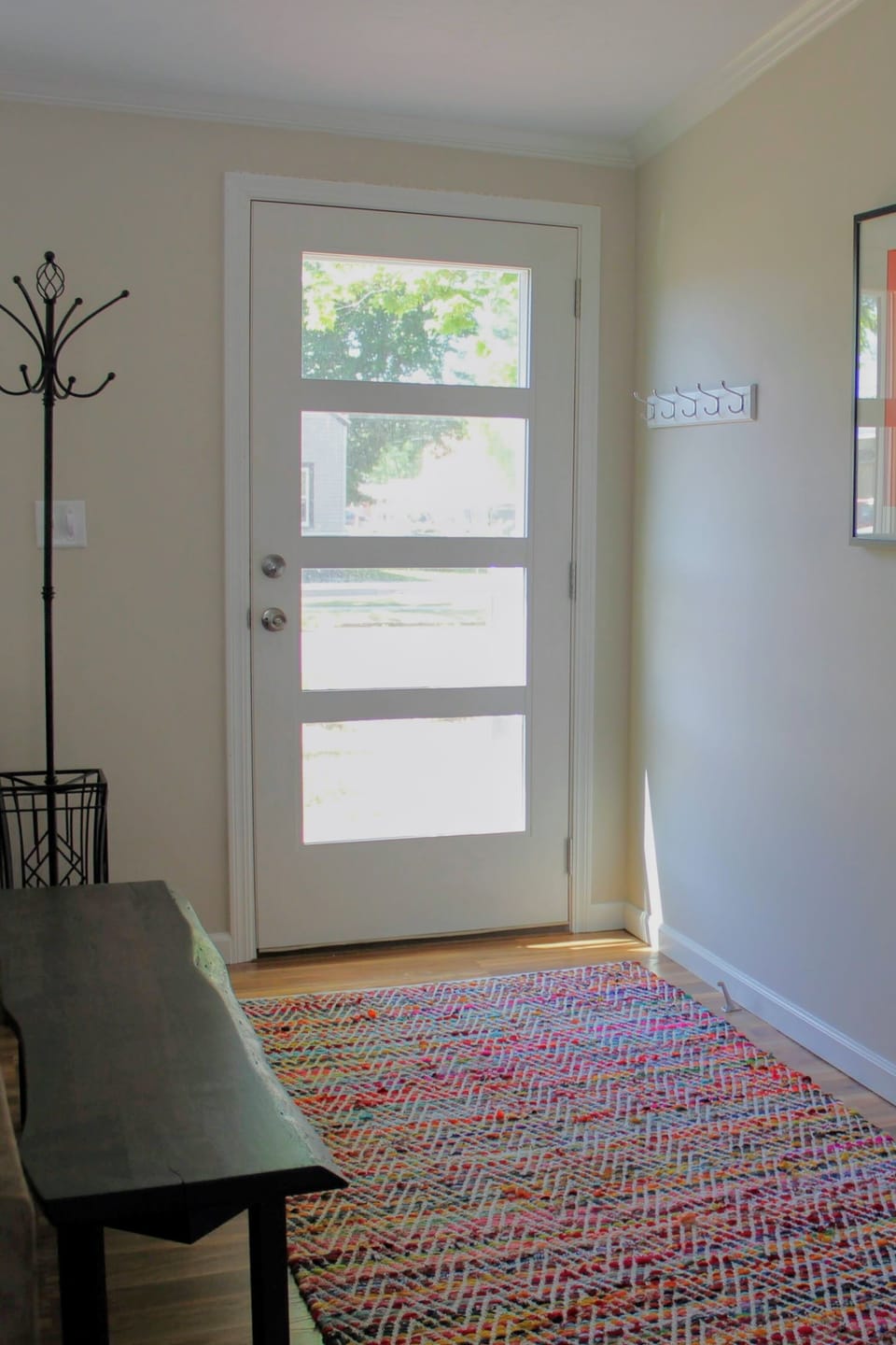 Plenty of coat hooks, bench and natural daylight for easy coming & going.