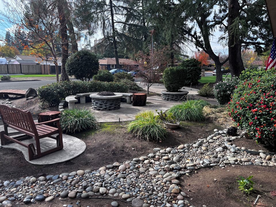 tranquil fire pit surrounded by rock river