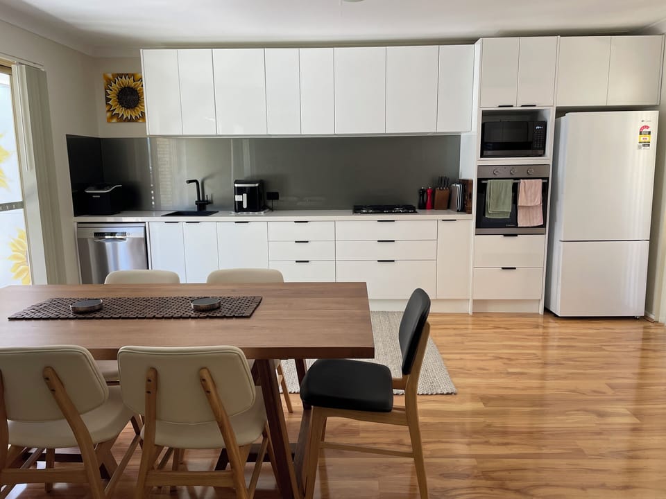 full kitchen with appliances. 6 seater dining table. Direct access to backyard