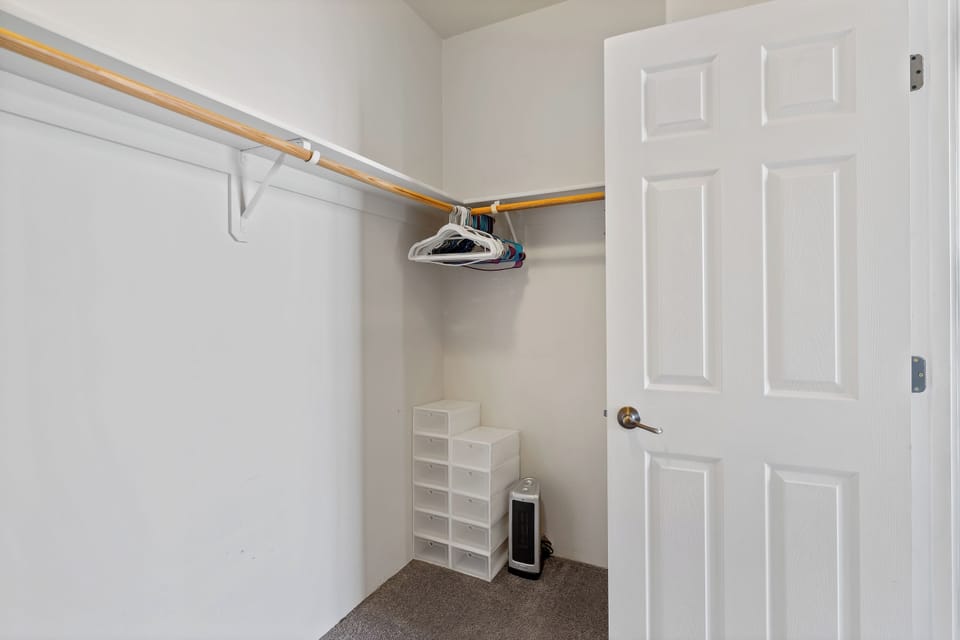 Walk-in closet in master bedroom on second floor.