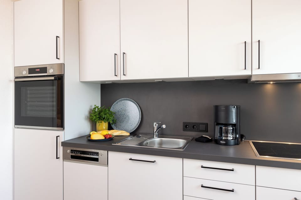Apartment Wellengang Wittdün/Amrum   Kitchen units with oven, dishwasher, hob and coffee machine