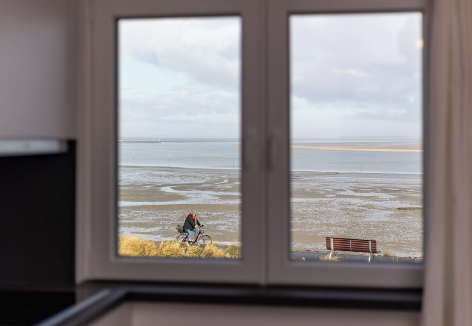 Apartment Wellengang Wittdün/Amrum   View from the kitchen and living room of the Wadden Sea (here at low tide)