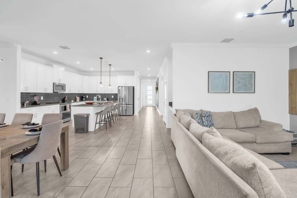 Experience luxury and comfort in this spacious open-plan living area, perfect for entertaining and relaxation in style.