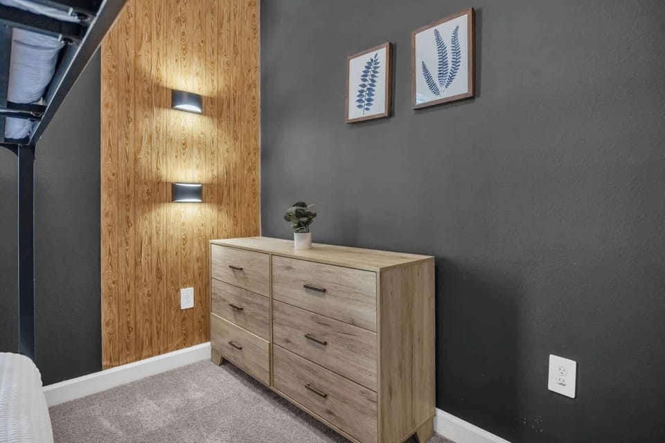 Cozy bedroom with stylish decor and ample storage, perfect for a restful stay.