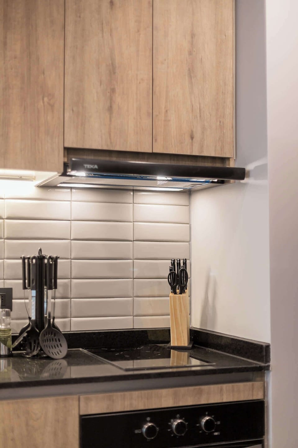 Modern kitchen with sleek appliances and ample storage, perfect for culinary enthusiasts.