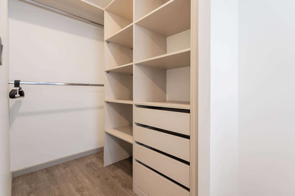 Spacious walk-in closet with ample storage for a clutter-free stay.