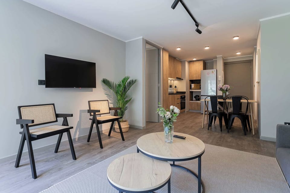 Chic and cozy living space with modern amenities, perfect for relaxation and dining in style.