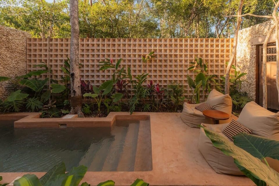 Spectacular pool with comfortable loungers. Patio with unique architectural design