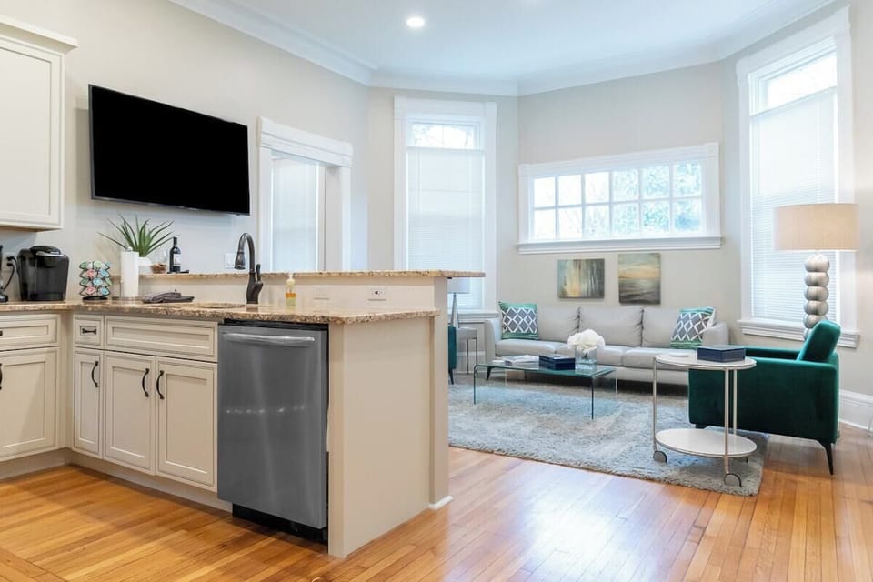 Kitchen with Counterbar Connected to Comfortable Living Space, with Mounted 58" Flatscreen 4K TV